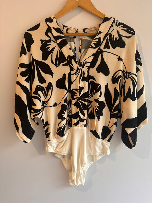 Outra · Body marca Peahi